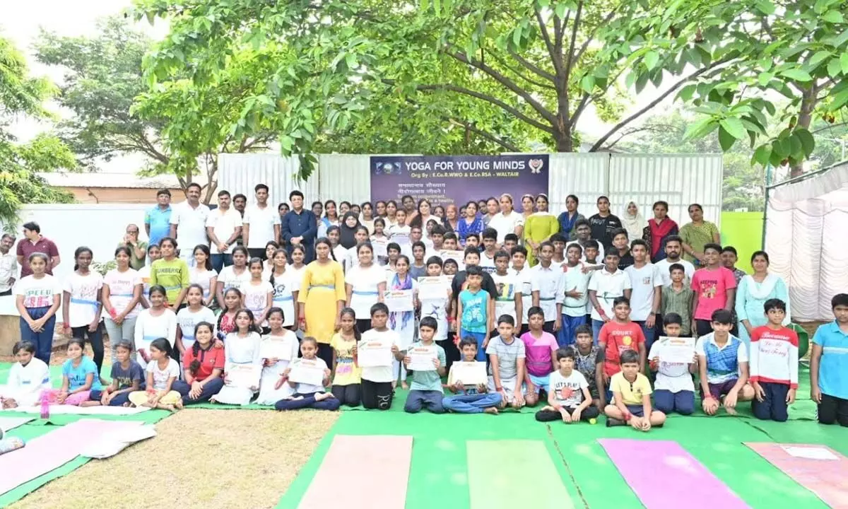 Divisional Railway Manager Anup Satpathy along with yoga camp participants in Visakhapatnam on Sunday