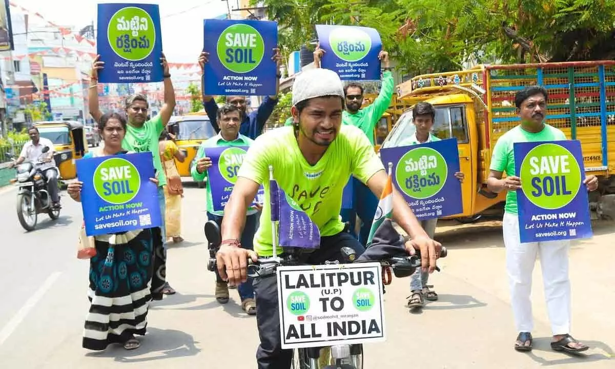 Mohit Niranjan from Uttar Pradesh on a cycle journey with ‘Save the Soil’ slogan in Tirupati on Tuesday. Photo Kalakata Radha krishna