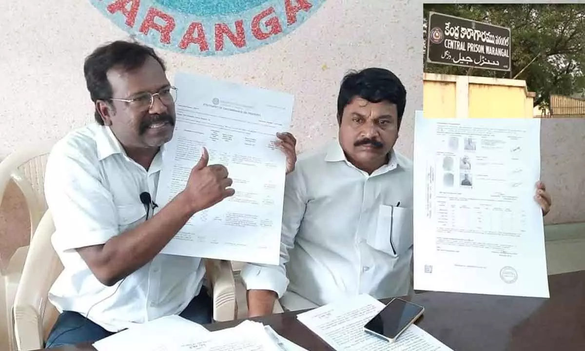 Congress leader Bakka Judson (left) showing the documents of mortgage to media persons in Hanumakonda on Tuesday. Congress Warangal spokesperson Md Ankus is also seen