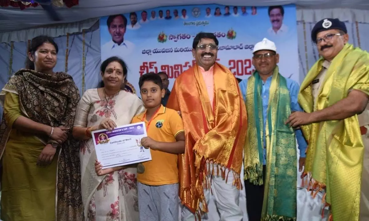 Winners of CM Cup being presented prizes in Nizamabad on Wednesday. Athletes in action
