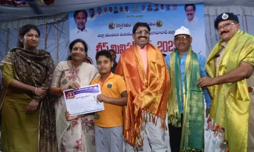 Winners of CM Cup being presented prizes in Nizamabad on Wednesday. Athletes in action
