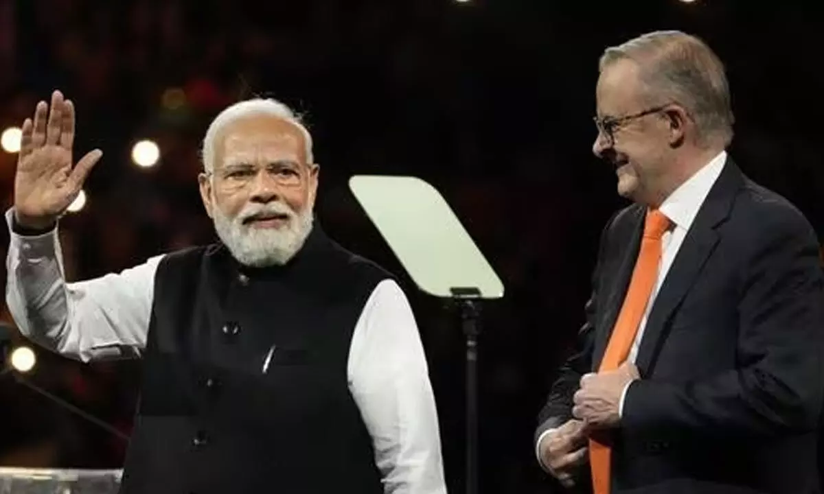 Prime Minister Narendra Modi and his Australian counterpart Anthony Albanese at an Indian community event at Qudos Bank Arena in Sydney on May 23(AP)