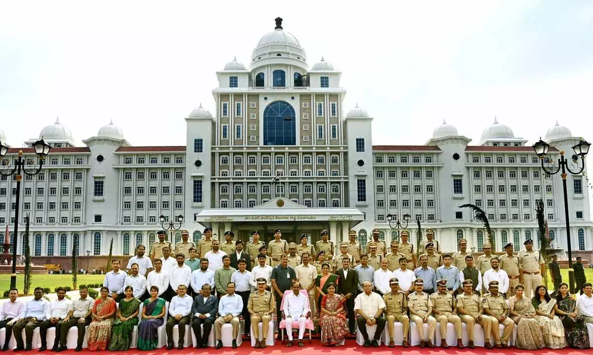 Chief Minister K Chandrashekar Rao along with District Collectors, Superintendents of Police and senior officials pose for a group photo in the lawns of the new Secretariat building in Hyderabad on Thursday