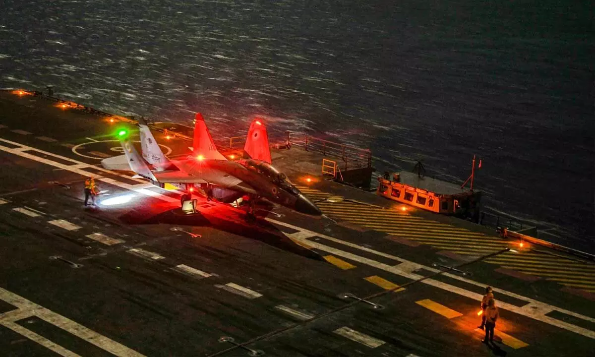 A MiG-29K aircraft makes a maiden night landing on INS Vikrant