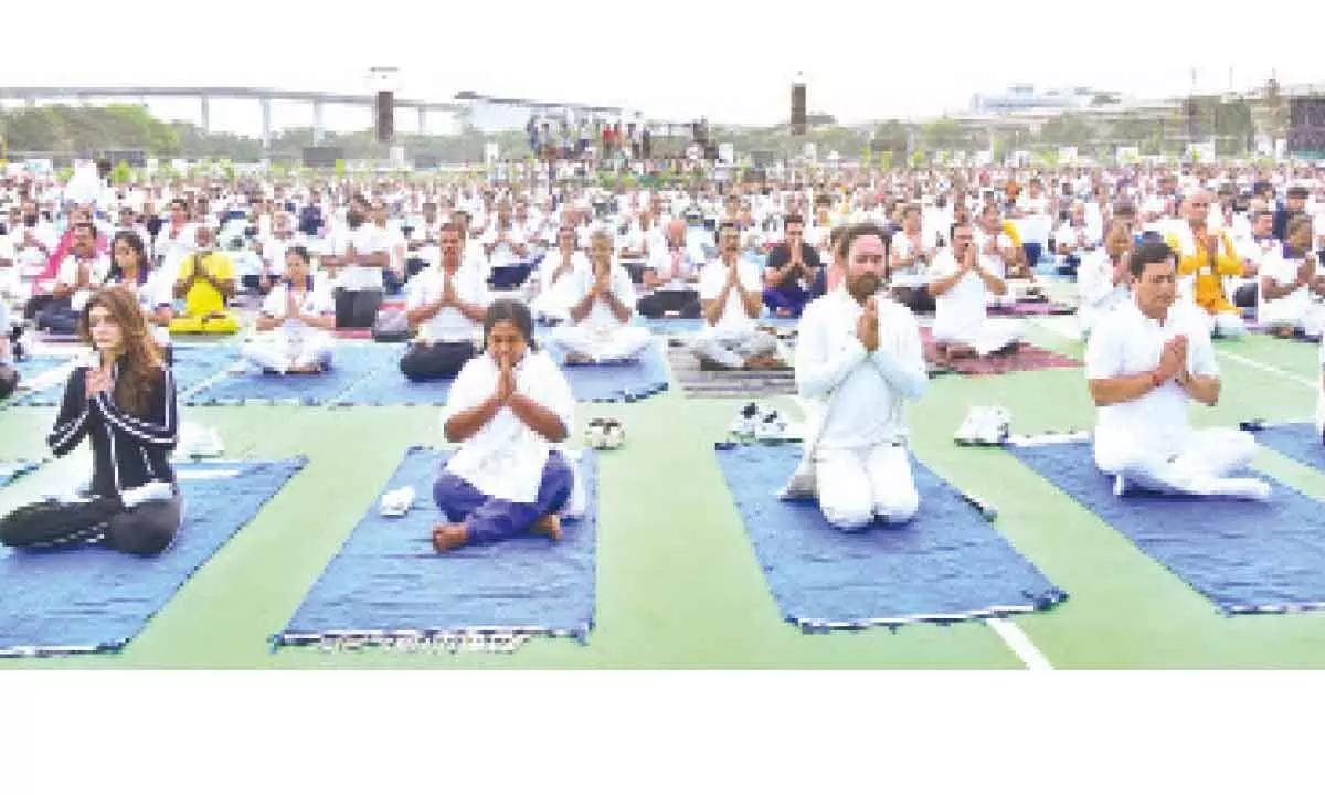 Governor Tamilisai Soundararajan, Union Ministers G Kishan Reddy and Sarbananda Sonowal, along with several celebrities taking part in the Yoga session at Parade grounds on Saturday