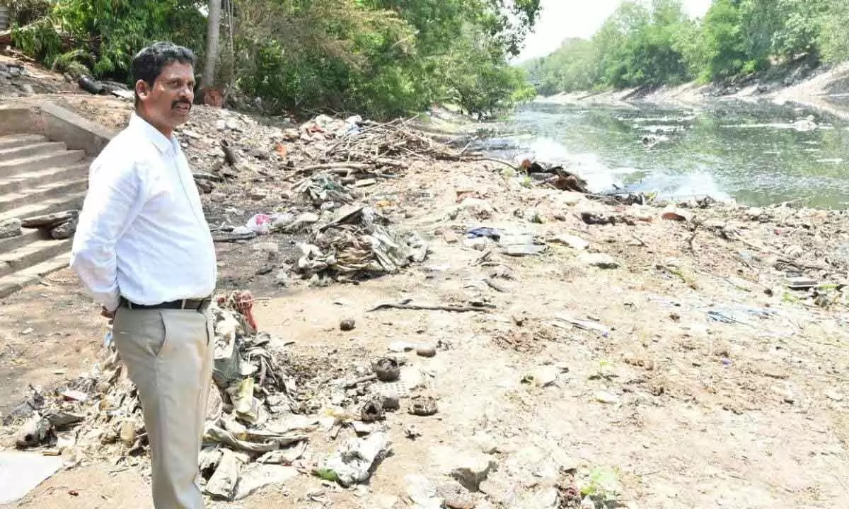 NTR district Collector S Dilli Rao inspecting water stagnation in Rives  canal in Vijayawada on Sunday