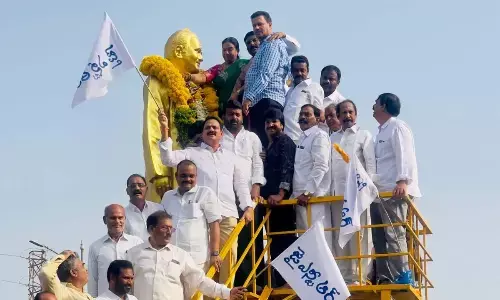 TANA former president Talluri Jaya Sekhar garlanding NTR statue in Khammam on Sunday.