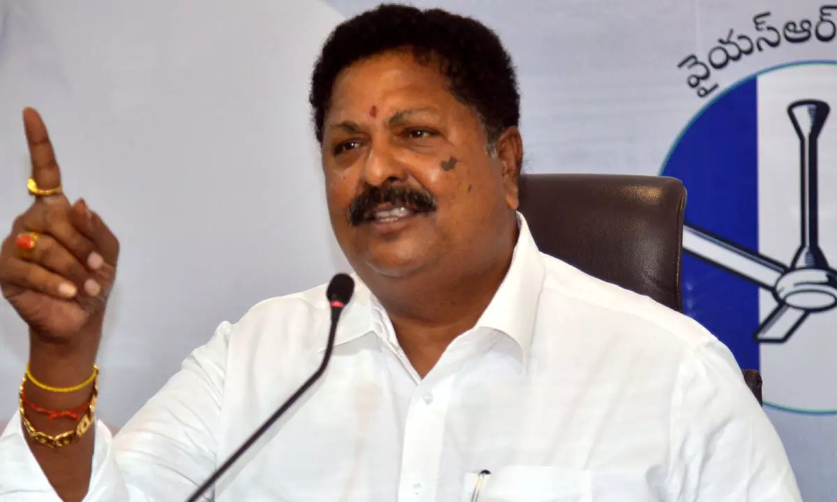 Minister for Civil Supplies Karumuri Venkata Nageswara Rao addressing a press conference at YSRCP central office in Tadepalli on Tuesday