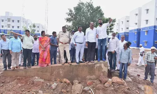 MLAs Kodali Nani, Perni Nani, MLC Talasila Raghuram and district Collector P Raja Babu inspecting the Gudivada TIDCO layout on Tuesday
