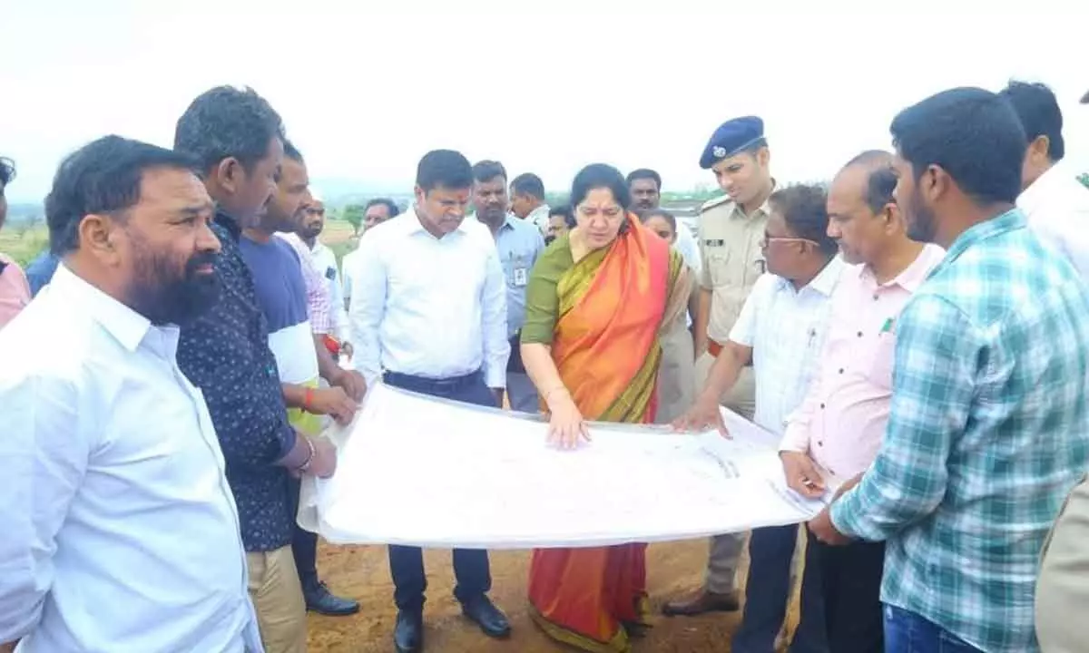 Minister for Tribal Welfare Satyavathi Rathod inspecting land for the construction of integrated collectorate complex in Mulugu on Tuesday