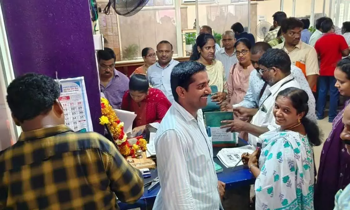 People waiting for their turn to get their property registration done at a sub-registrar office near Super Bazaar in Visakhapatnam