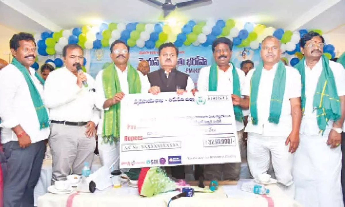 District Collector K Venkataramana Reddy, MLAs K Sanjeevaiah and K Adimulam, releasing the YSR Rythu Bharosa – PM Kisan cheque at Tada in Sullurpet constituency in Tirupati district on Thursday