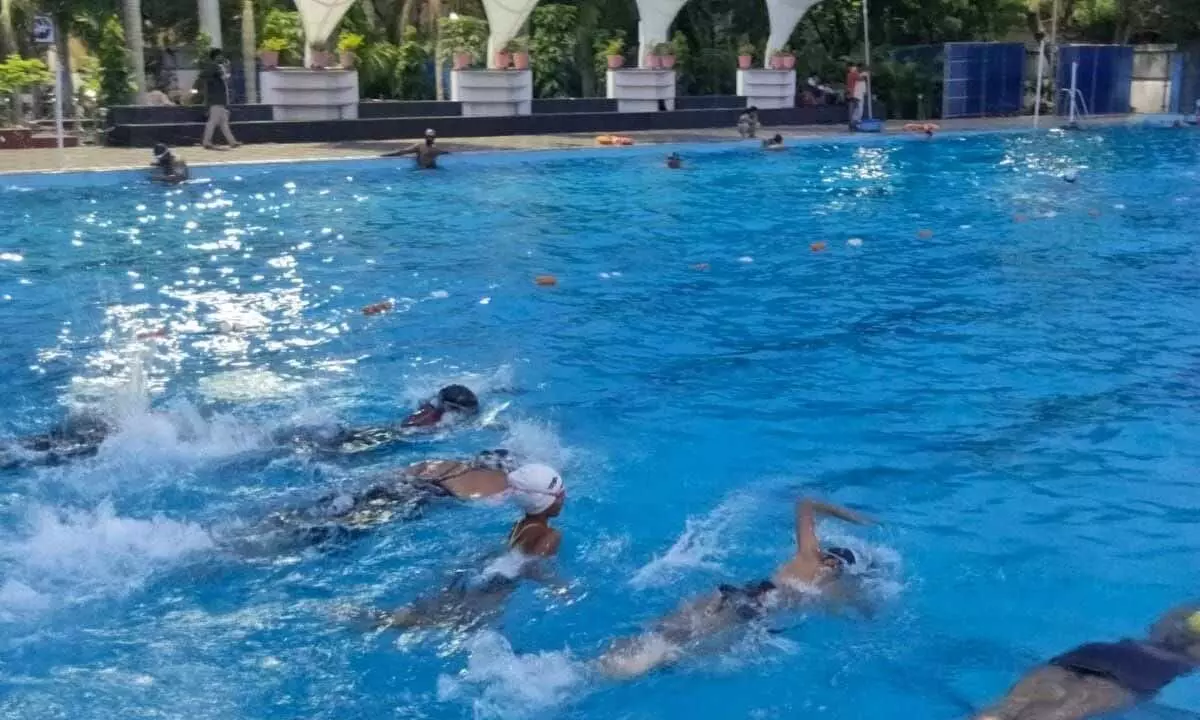 Swimmers practising in Vijayawada on Sunday