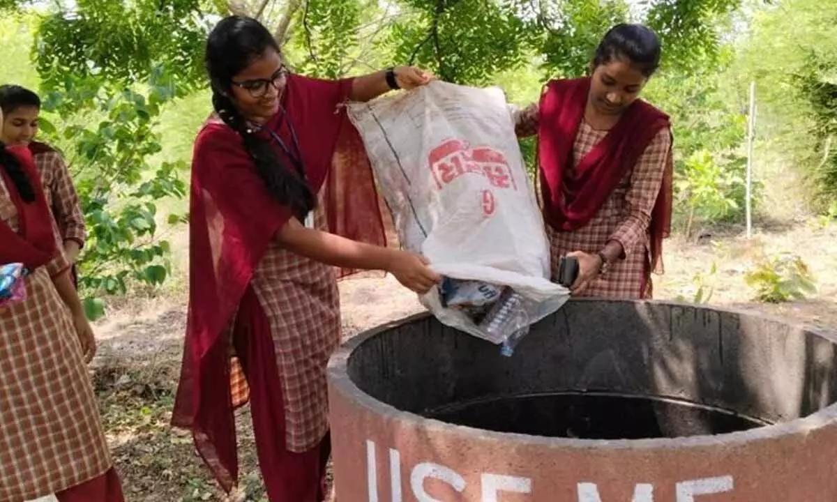 05  Students of Women’s Degree & PG College cleaning the forest on account of World Environment Day in Khammam on Monday