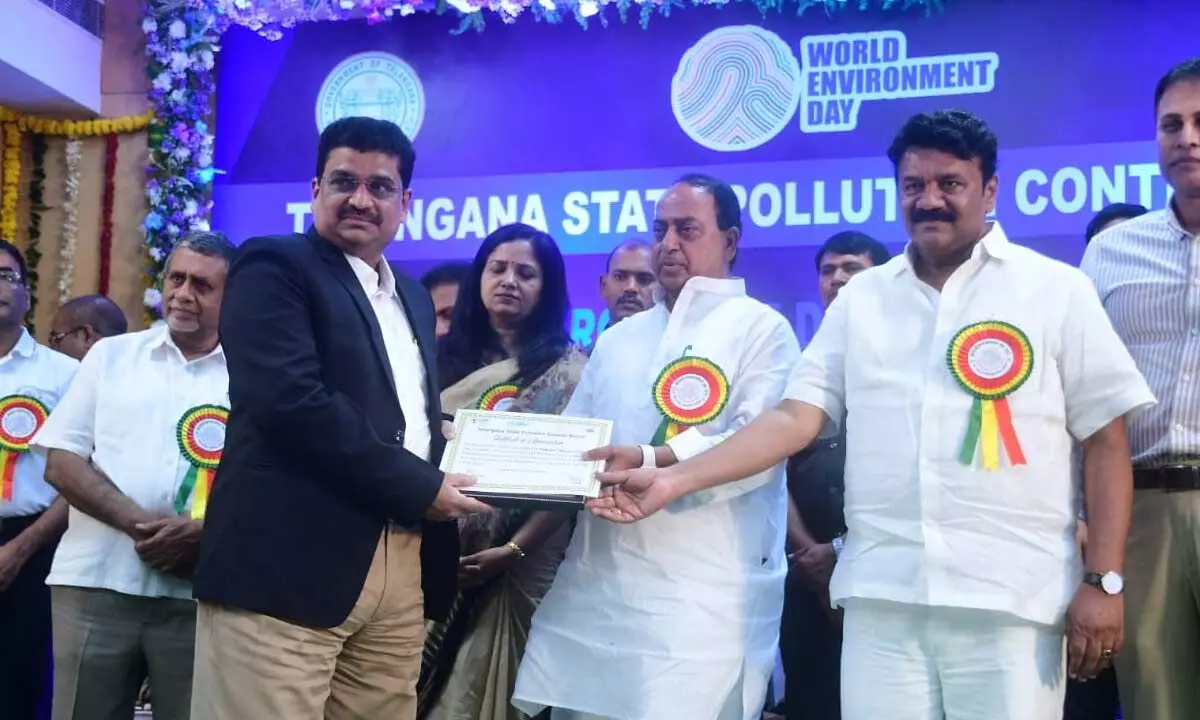 Ministers of Forest and Animal Husbendray A Indrakan Reddy and Srinivas Yadav presenting the Environment-friendly  Pratices Award to Singareni Thermal Power Plant chief  Viswanatha Raju in Hyderabad on Monday