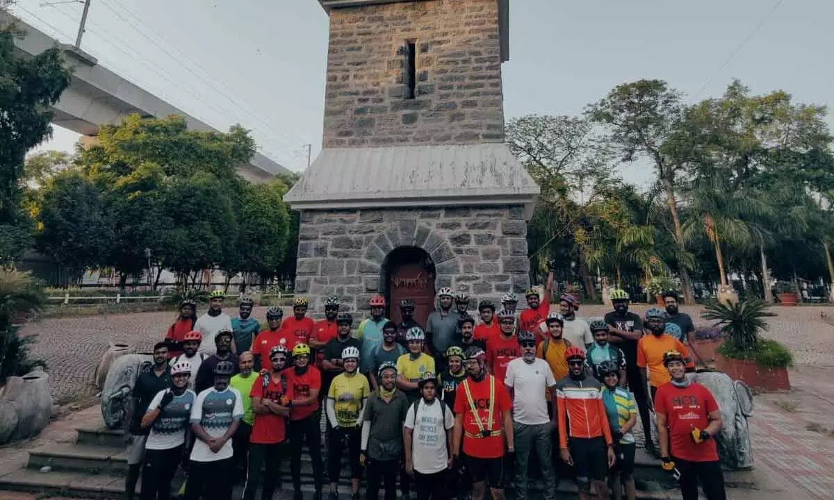 Cyclists in awe of Secunderabad Clock Tower
