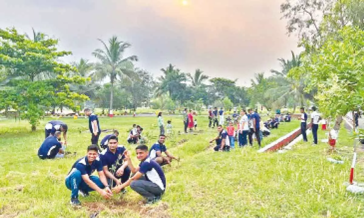 Participants at a tree plantation drive organised by the Eastern Naval Command