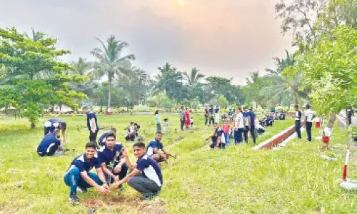 Participants at a tree plantation drive organised by the Eastern Naval Command