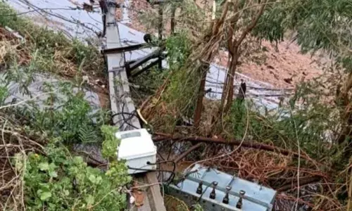 An uprooted electric pole fell on ground due to strong gales at Jonnagiri village in Tuggali mandal in Pathikonda constituency on Wednesday