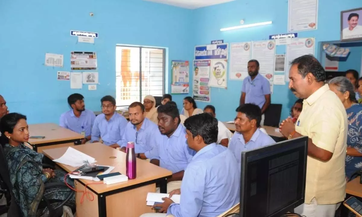 Municipal Commissioner D Haritha checking the records at the secretariat in 5th Division in Tirupati on Thursday.  (Right) Mayor Dr Sirisha inspecting the road at SKD Nagar in Tirupati on Thursday.