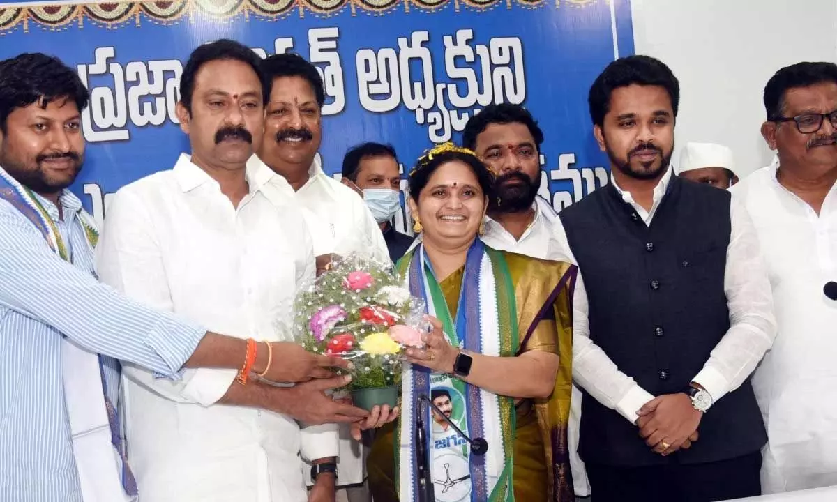 MLA Alla Nani congratulating Ghanta Padmasree over her election as the president of joint West Godavari district Praja Parishad, in Eluru on Thursday
