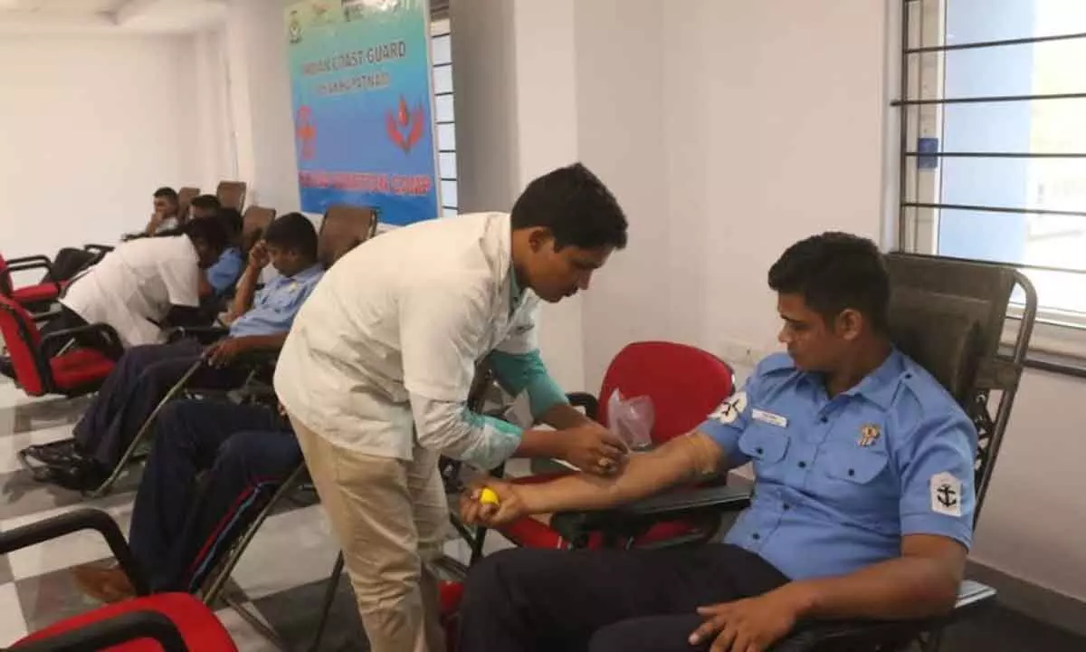 Coast Guard personnel donating blood at the camp in Visakhapatnam on Friday.