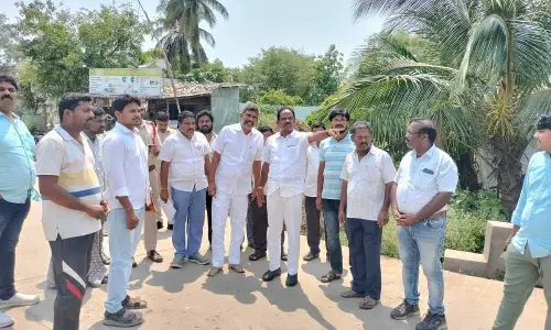 Deputy Chief Minister B Mutyala Naidu with the officials at Devarapalli in Anakapalli on Thursday