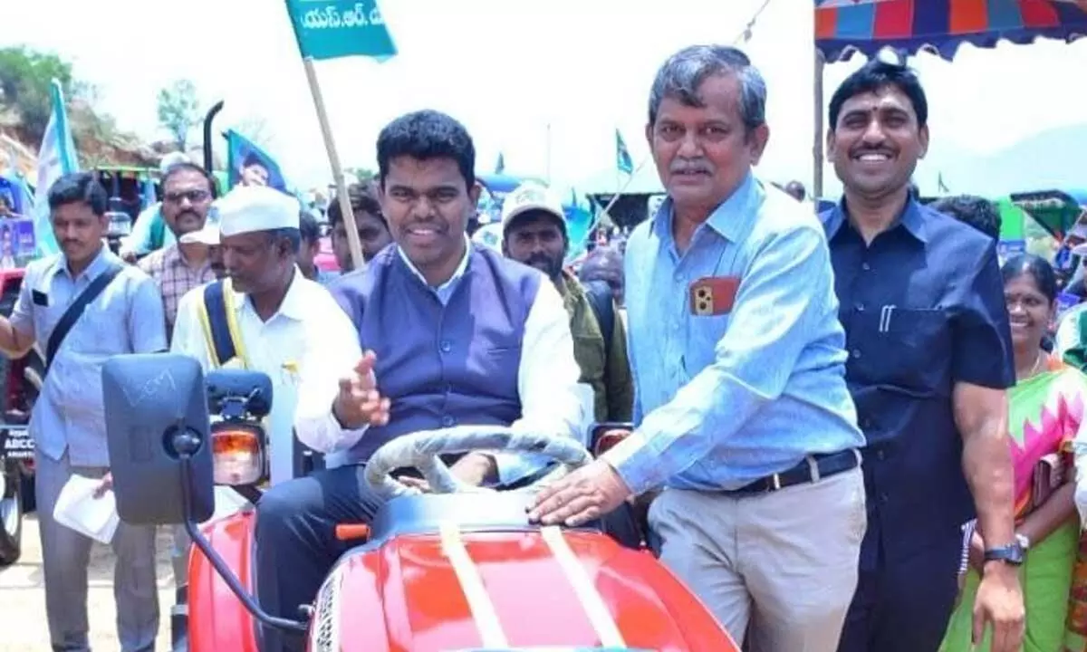District Collector P Arun Kumar trying his hand on a farm  machine at the YSR Farm Mechanisation Mela held in  Puttaparthi on Friday