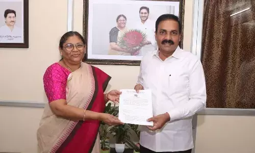 Agriculture Minister Kakani Govardhan Reddy presenting the research papers during viva presentation held at Vikrama Simhapuri University in Nellore on Friday