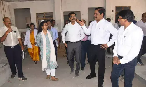 Medical and health special chief secretary M T Krishna Babu with district collector S Nagalakshmi and other officials at the medical college building in Vizianagaram on Friday