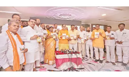 Union Industries Minister Mahendra Nath Pandey releasing a book on PM Narendra Modi’s rule during the press meet held in Nalgonda on Saturday