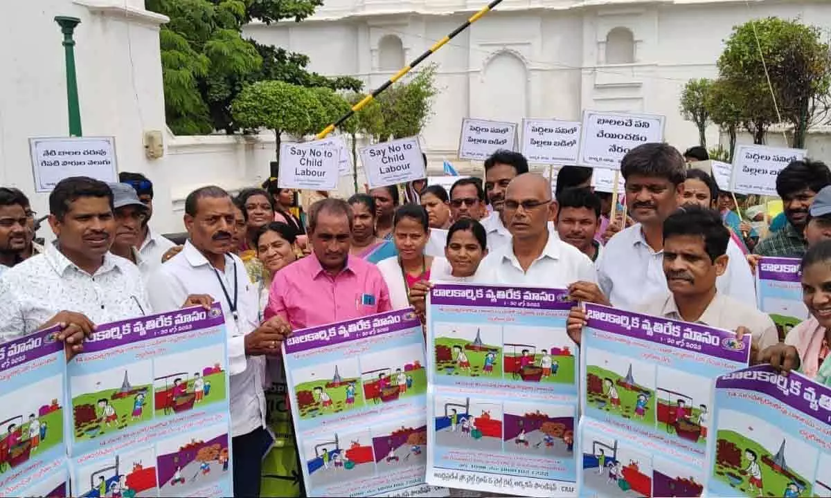 CRPC chairman Kesali Apparao  and others releasing wall posters on eradication of child labour in Vizianagaram on Monday