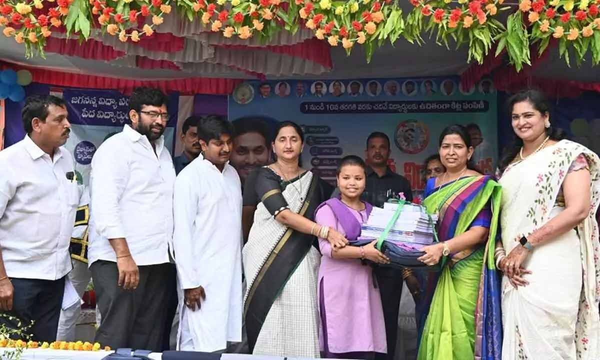 Home Minister Taneti Vanitha and district Collector Dr K Madhavi Latha distributing JVK Kit to a student at ZPHS in Satellite City, Rajahmundry rural mandal on Monday