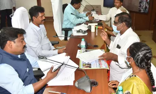 NTR district Collector S Dilli Rao receiving petitions from the public during Spandana programme at the Collectorate in Vijayawada on Monday