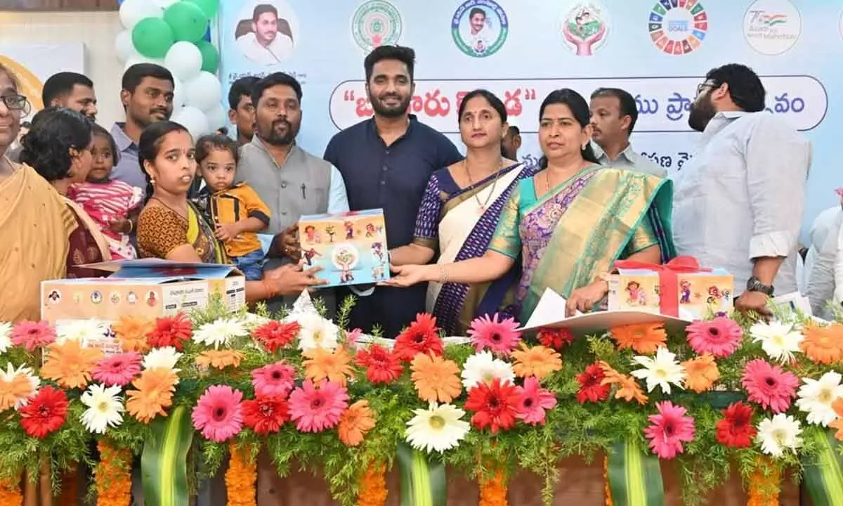 Home Minister Taneti Vanitha and district Collector Dr K Madhavi Latha giving nutritional kits to the children in Rajamahendravaram on Wednesday under Bangaru Konda scheme. MP Margani Bharat is also seen.