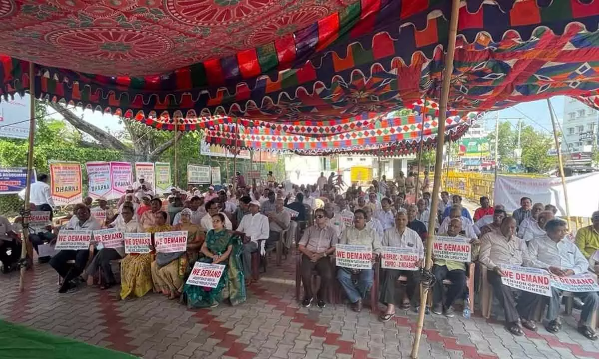 Bank pensioners staging a protest at Dharna Chowk in Vijayawada on Wednesday