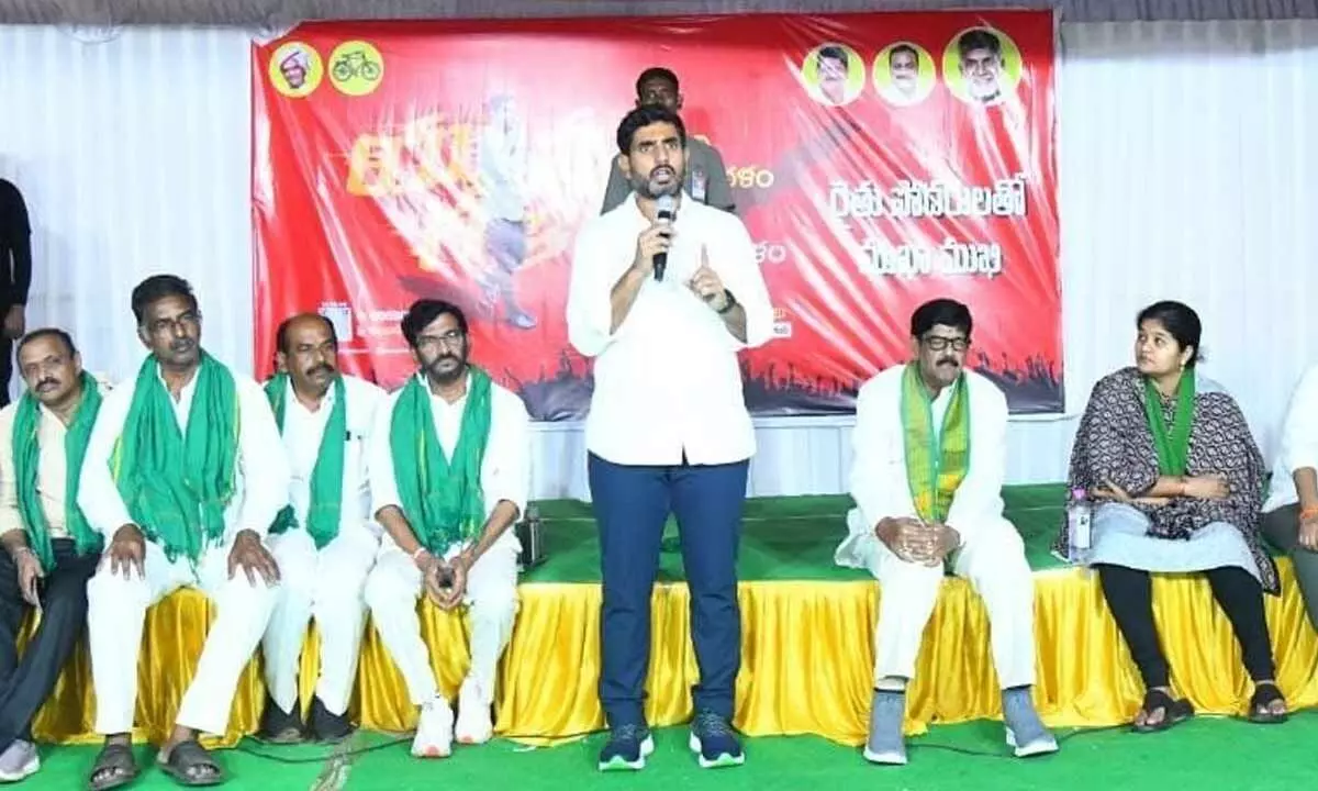 TDP national general secretary Nara Lokesh addressing farmers during an interactive programme at Kadirinaidu Palle campsite in Nellore district on Wednesday. Party politburo member Somireddy Chandramohan Reddy, Venkatagiri MLA Anam Ramanarayan Reddy and others are seen.