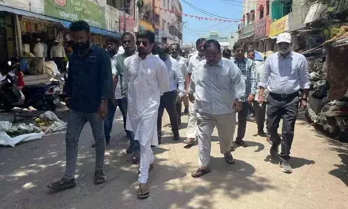 Deputy Mayor Bhumana Abhinay Reddy along with the TTD and Municipal Corporation officials inspecting a road proposed for widening in Tirupati on Tuesday