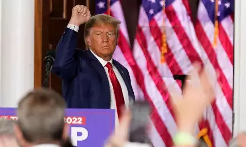 Former President Donald Trump gestures after speaking at Trump National Golf Club in New Jersey on Tuesday after pleading not guilty in a Miami courtroom earlier in the day to dozens of felony counts that he hoarded classified documents and refused government demands to give them back