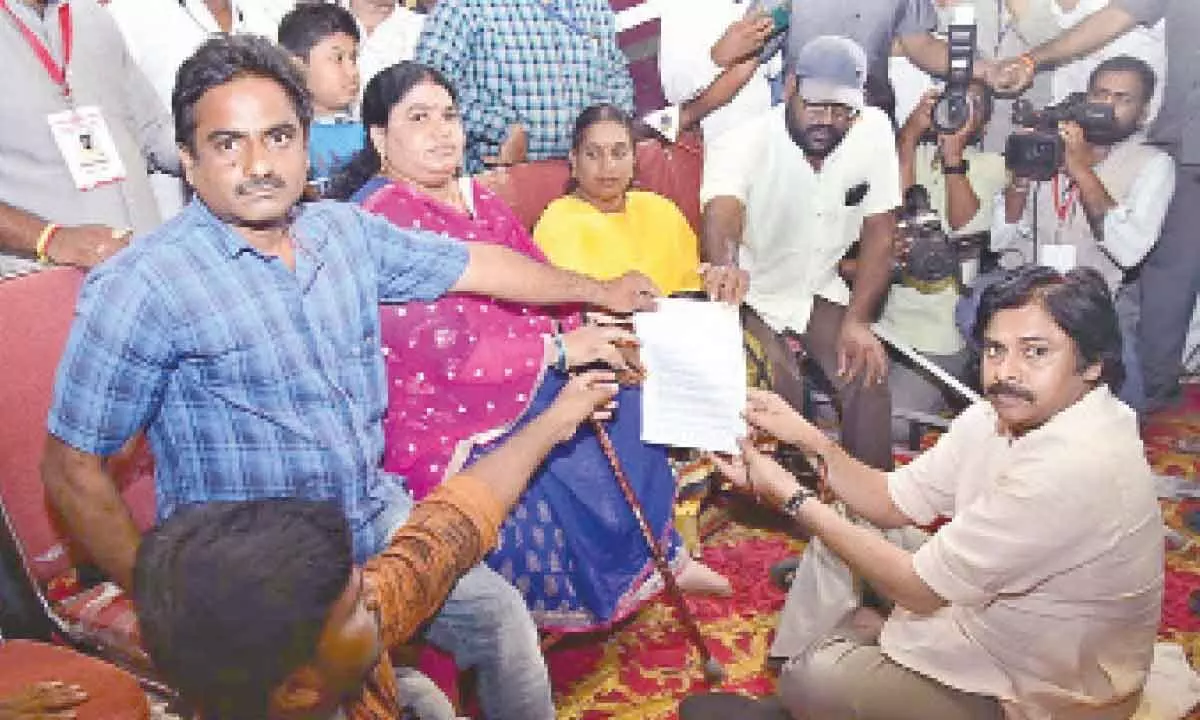 Jana Sena chief Pawan Kalyan receiving petitions from differently-abled persons as part of party’s Janavani programme in Pithapuram on Thursday