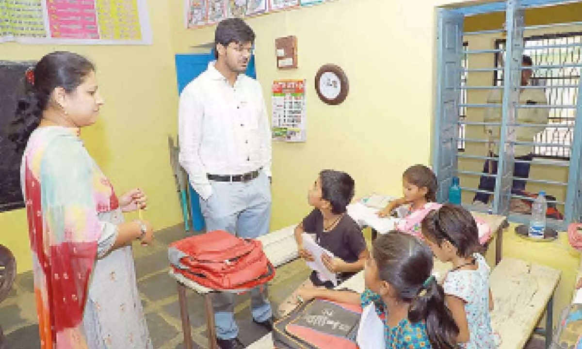 District Collector VP Gautham interacting with students at Surya Tanda in Khammam district on Thursday