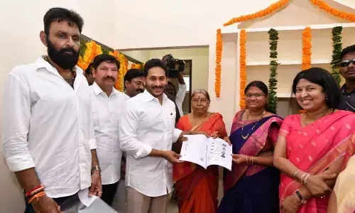YS Jagan distributes TIDCO houses in Gudivada, takes dig at Naidu