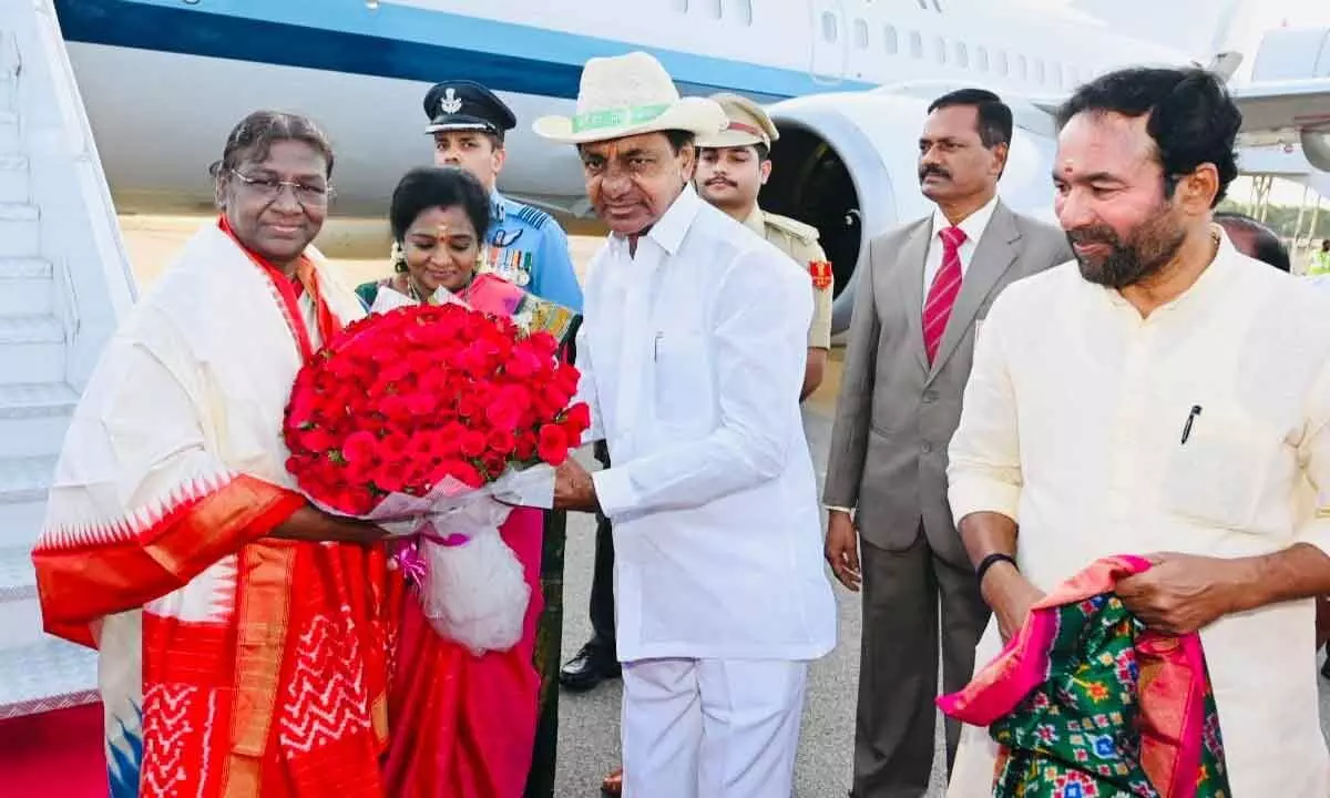 Chief Minister K Chandrashekar Rao welcoming President Draupadi Murmu, at Begumpet airport in Hyderabad on Friday
