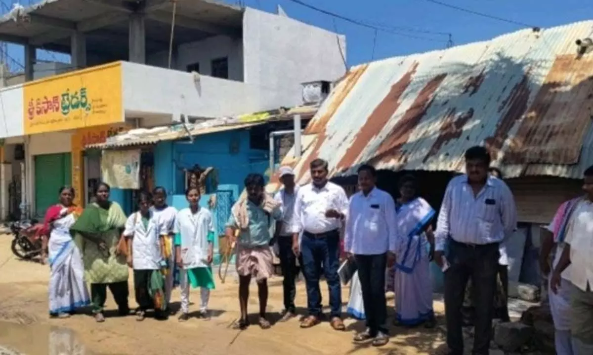 Malaria sub-unit officer Saibaba along with the medical team and sarpanch inspecting the village surroundings at Ternakal village in Devanakonda mandal on Friday