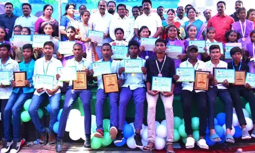 Minister A Suresh, Prakasam District Collector A S Dinesh Kumar, MLA Balineni Srinivasa Reddy and others with Jagananna Animutyalu awardees in Ongole on Saturday