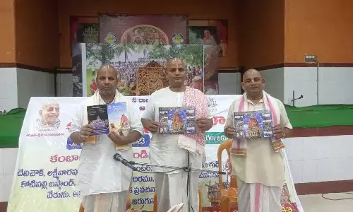 ISKCON Rajamahendravaram branch Chairman Shyamanga Srinivasa Das and others releasing the the brochures of the Jagannath Rath Yatra Mahotsavam in Rajamahendravaram on Saturday