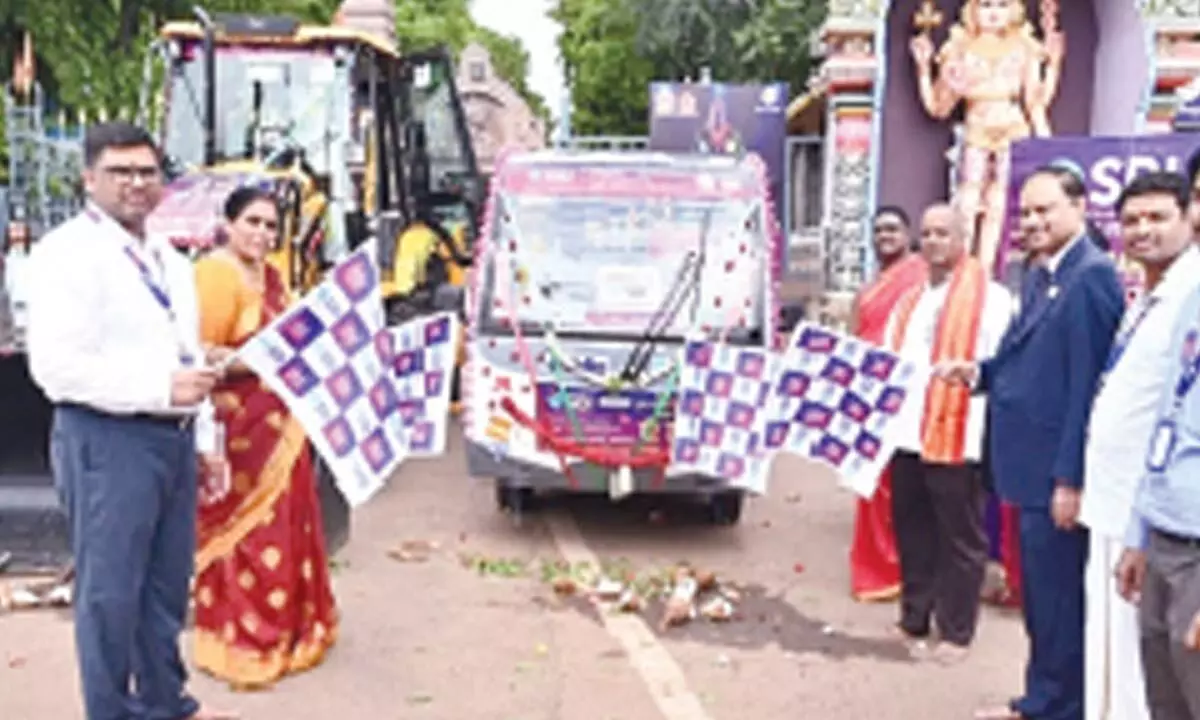 State Bank of India, Amaravati circle, Chief General Manager Naveen Chandra Jha flags off the vehicles donated to Srisailam temple on Sunday.