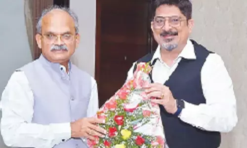 Chief Secretary K S  Jawahar Reddy and CEO of EESL Vishal Kapoor in Vijayawada