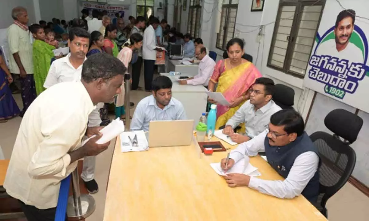Joint Collector P Srinivasulu receiving petitions at Spandana programme in Chittoor on Monday