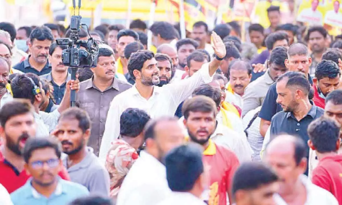 TDP national general secretary Nara Lokesh greeting people during his Yuva Galam Padayatra at Rapur village in Venkatagiri constituency in Nellore district on Tuesday